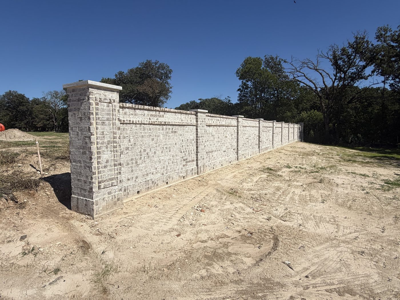 Brick screen wall with brick columns and stone caps, Morningside, Weatherford