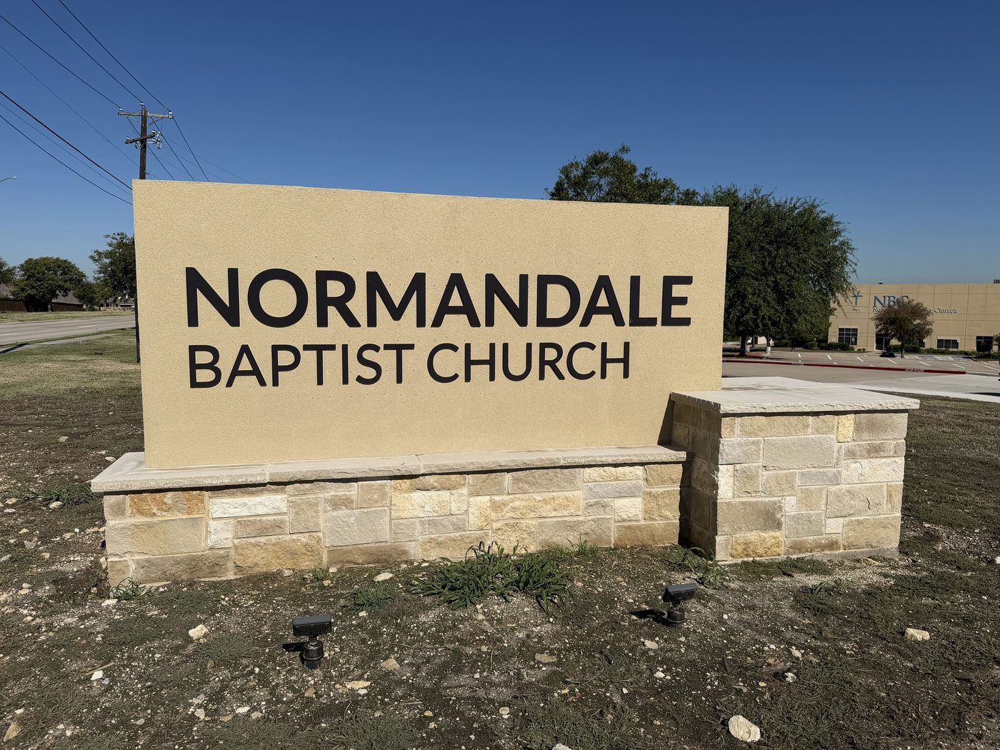 Stucco sign wall on a stone base, Normandale Baptist Church, Fort Worth