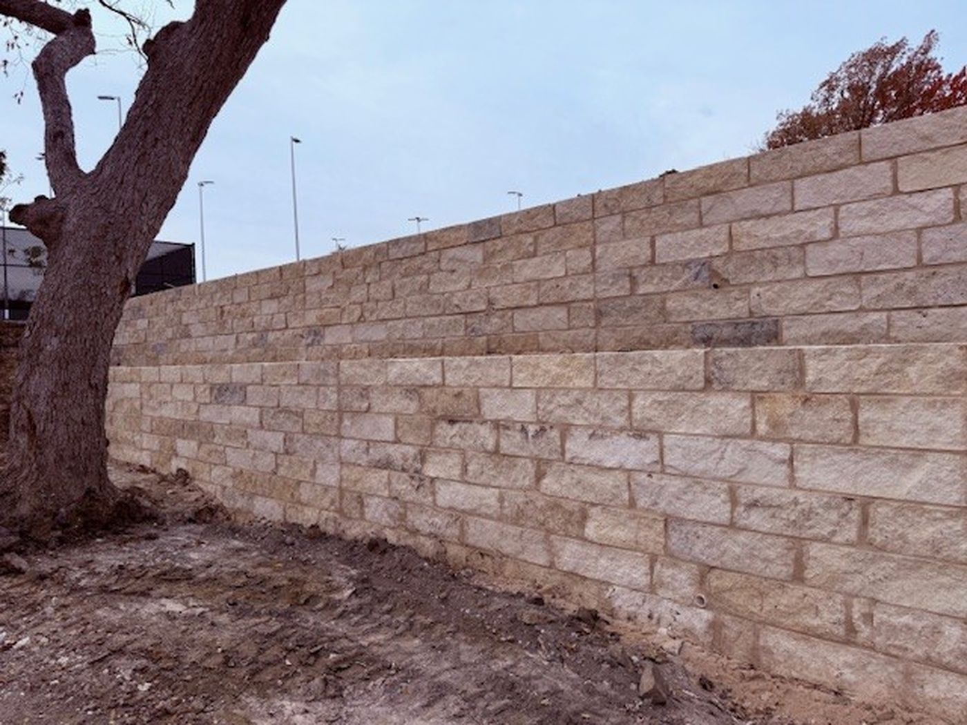 Cut limestone walls around the courts, Northwood Club Pickleball Courts, Dallas
